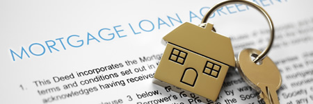 House keychain with mortgage loan document
